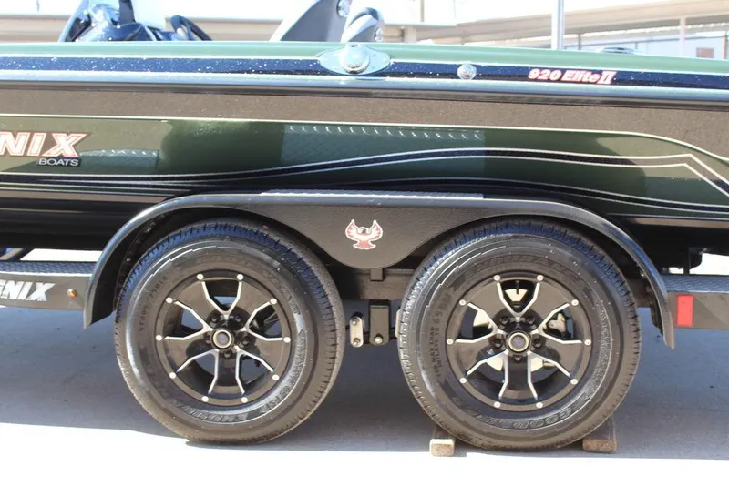 Slide: The Image of 2025 Phoenix 920 Elite II boat trailer with sleek black wheels and logo. - 6