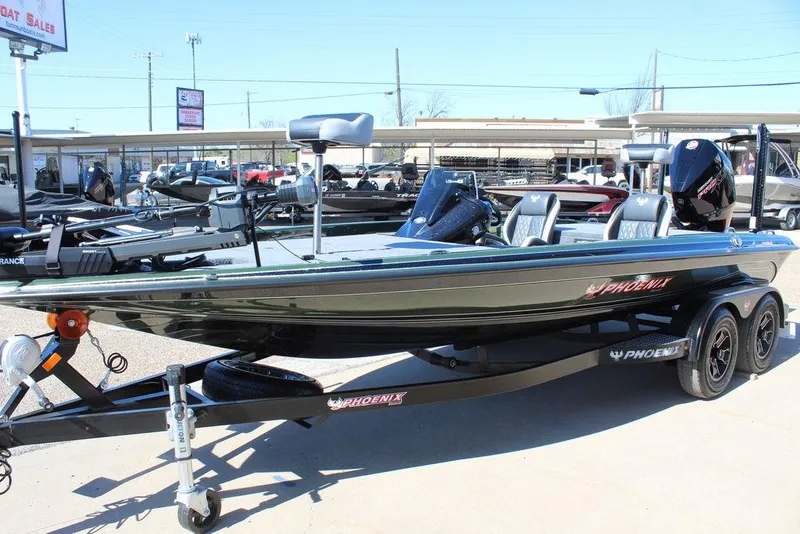 Slide: The Image of 2025 Phoenix 920 Elite II boat on trailer at dealership. - 8