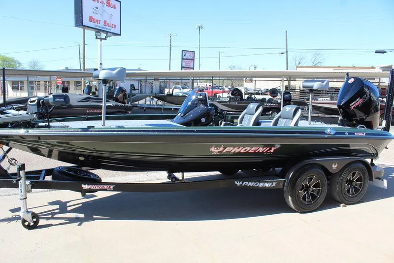 Slide: The Image of 2025 Phoenix 920 Elite II boat on trailer, displayed at dealership. - 9