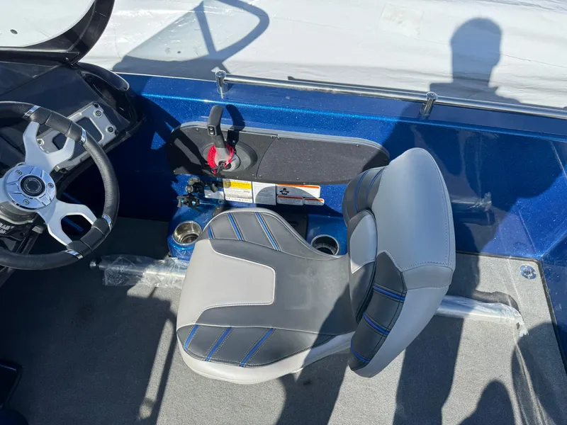 Slide: The Image of 2024 Nitro ZV19 Sport boat interior with steering wheel and seat. - 13