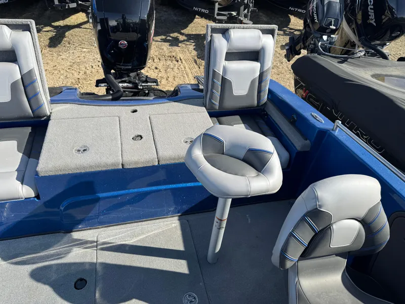 Slide: The Image of 2024 Nitro ZV19 Sport boat interior with gray seating and blue accents. - 15