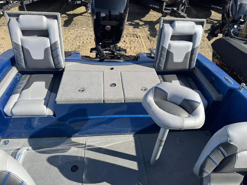 Slide: The Image of 2024 Nitro ZV19 Sport boat interior with gray seating and blue accents. - 17