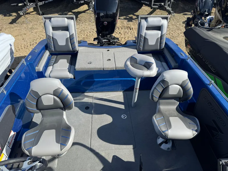 Slide: The Image of 2024 Nitro ZV19 Sport boat interior with four gray seats and blue accents. - 6