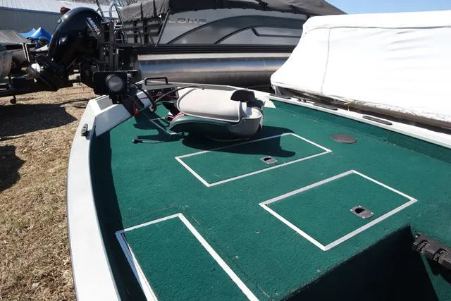 Slide: The Image of 1999 Lowe 170 boat with green deck carpet and fishing seat. - 2