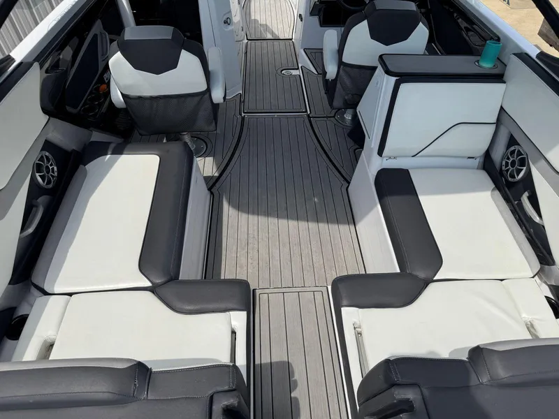 Slide: The Image of Interior of 2021 Yamaha Boats 252SE, featuring sleek seating and modern design elements. - 10