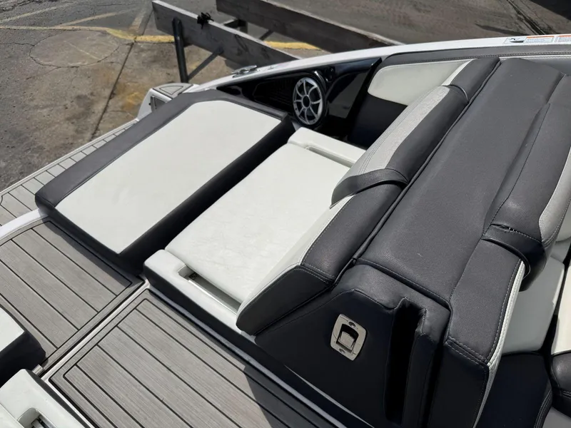 Slide: The Image of 2021 Yamaha Boats 252SE interior with sleek seating and modern design. - 16