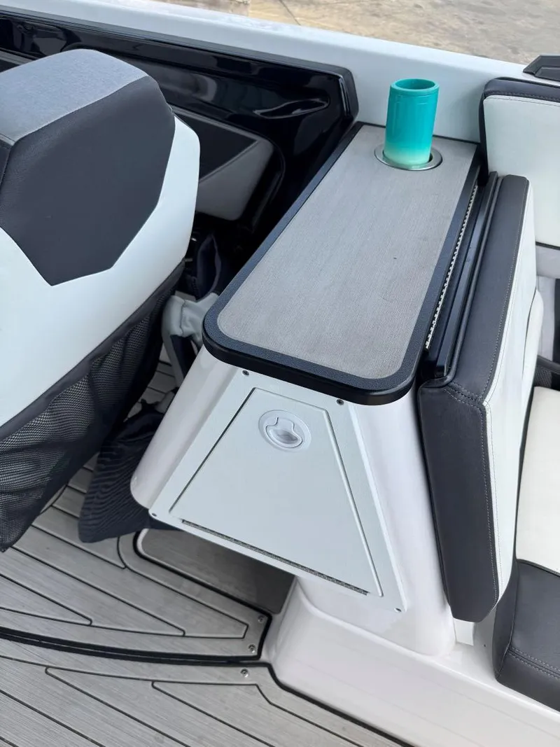 Slide: The Image of 2021 Yamaha Boats 252SE interior with seating and cup holder detail. - 22