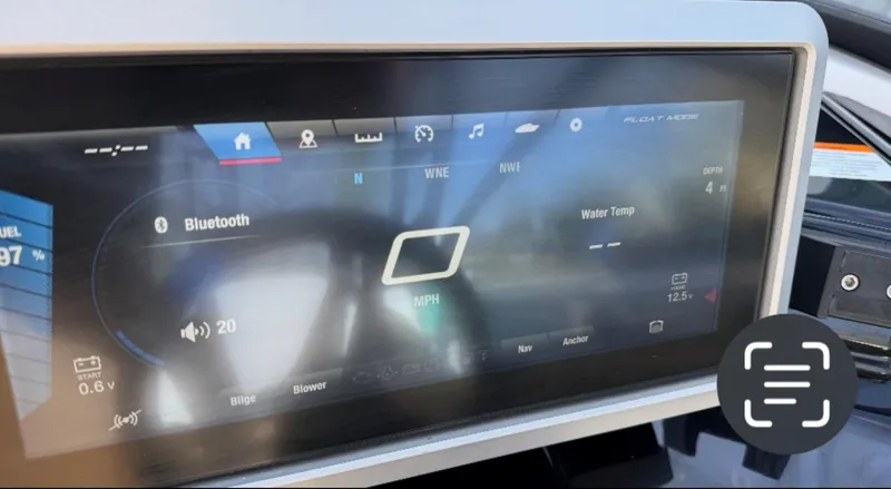 Slide: The Image of Dashboard display of a 2021 Yamaha Boats 252SE, showing Bluetooth and water temperature. - 34