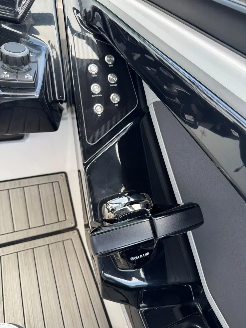 Slide: The Image of Control panel of 2021 Yamaha Boats 252SE with sleek design and modern features. - 38