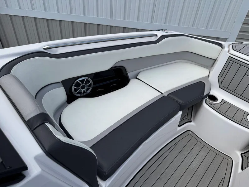 Slide: The Image of 2021 Yamaha Boats 252SE interior with sleek seating and integrated speaker system. - 41