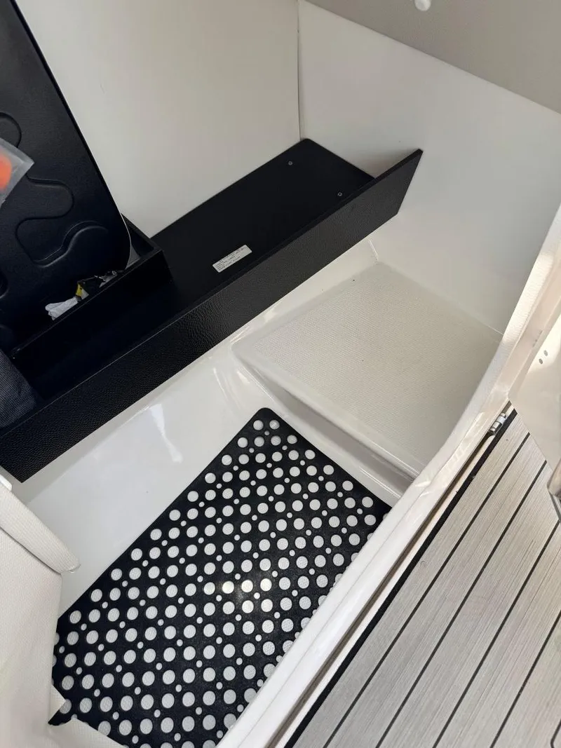 Slide: The Image of 2021 Yamaha Boats 252SE interior with polka dot mat and sleek design. - 48