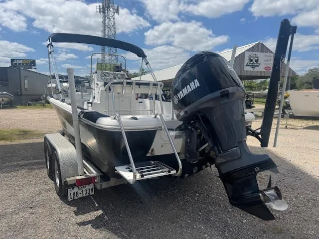 Slide: The Image of 2010 NauticStar 2110 Nautic Bay boat with Yamaha outboard motor on a trailer. - 6