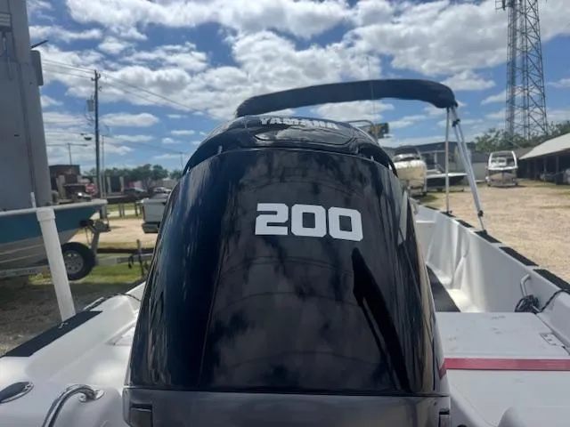 Slide: The Image of 2010 NauticStar 2110 Nautic Bay with Yamaha 200 engine in a sunny outdoor setting. - 7