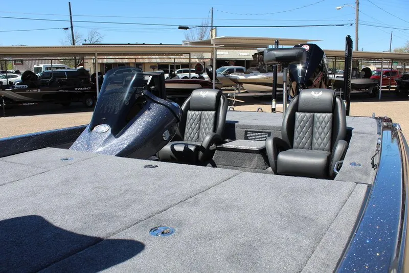 Slide: The Image of 2025 Phoenix 921 ELITE boat interior with sleek seating and modern dashboard. - 12