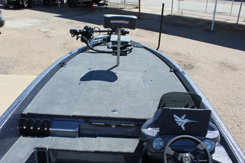Slide: The Image of 2025 Phoenix 921 ELITE boat with spacious deck and advanced steering controls. - 19