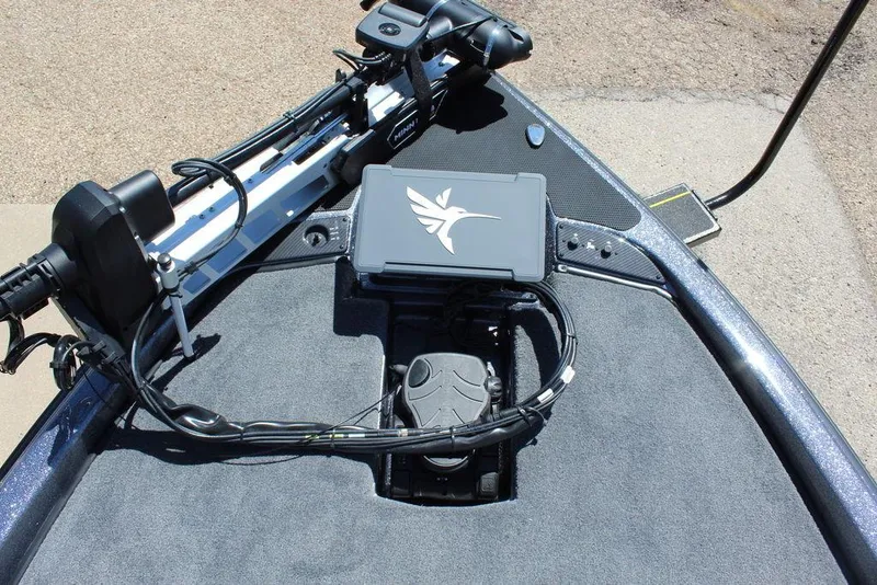 Slide: The Image of 2025 Phoenix 921 ELITE boat deck with advanced navigation equipment and sleek design. - 20