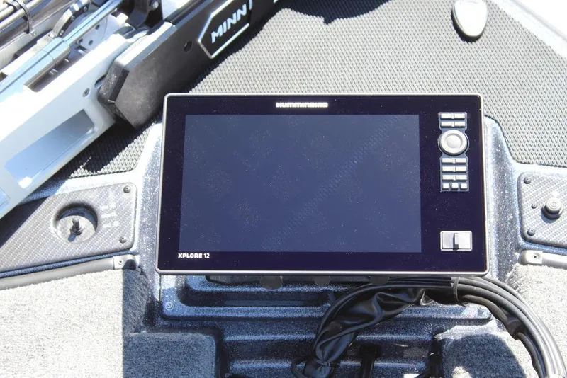 Slide: The Image of Fishfinder display on a 2025 Phoenix 921 ELITE boat dashboard. - 21