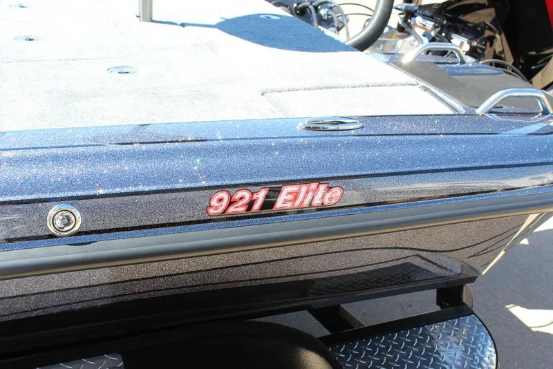 Slide: The Image of 2025 Phoenix 921 ELITE boat, close-up of model name on sleek exterior. - 25