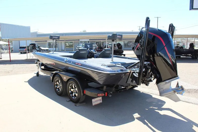 Slide: The Image of 2025 Phoenix 921 ELITE boat on trailer, featuring sleek design and powerful engine. - 4