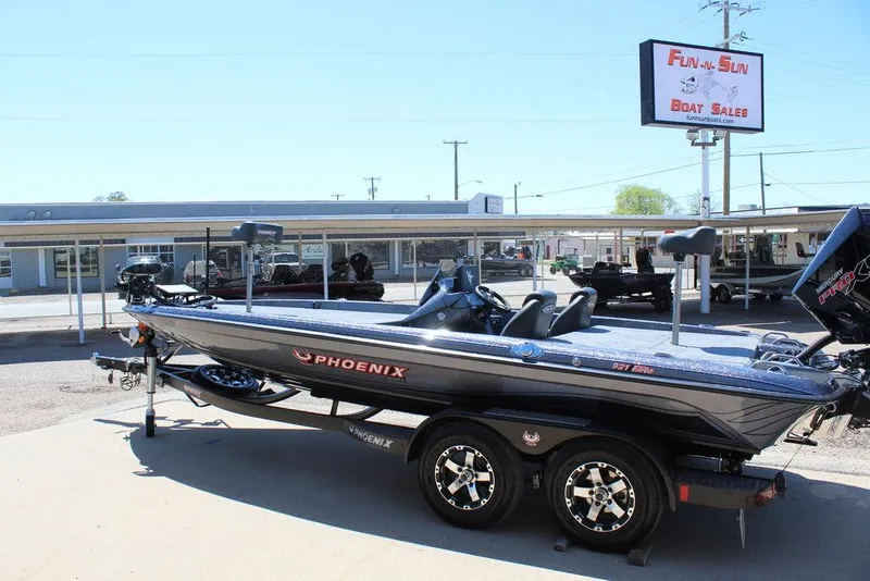 Slide: The Image of 2025 Phoenix 921 ELITE boat at dealership, showcasing sleek design and modern features. - 6