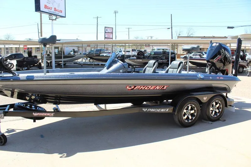 Slide: The Image of 2025 Phoenix 921 ELITE boat on trailer at dealership, side view. - 7
