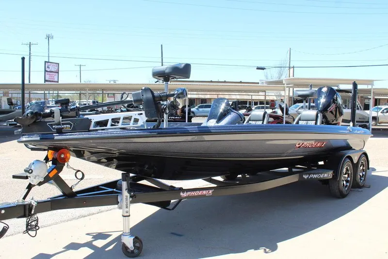 Slide: The Image of 2025 Phoenix 921 ELITE boat on trailer, displayed outdoors in a dealership lot. - 9