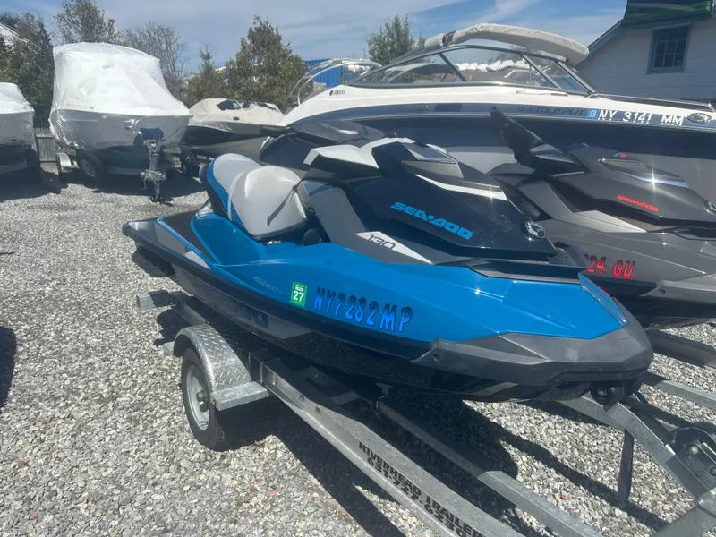 Slide: The Image of 2019 Sea-Doo GTI SE 130 jet ski on trailer, parked in a boatyard. - 6