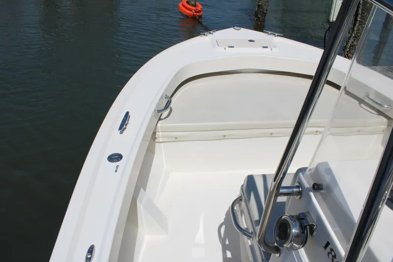 Slide: The Image of 2006 Parker 1801 Center Console boat, white deck, docked on calm water. - 15
