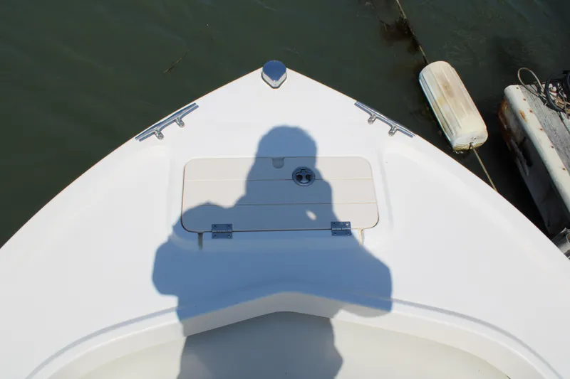 Slide: The Image of Shadow on 2006 Parker 1801 Center Console boat deck near water. - 17