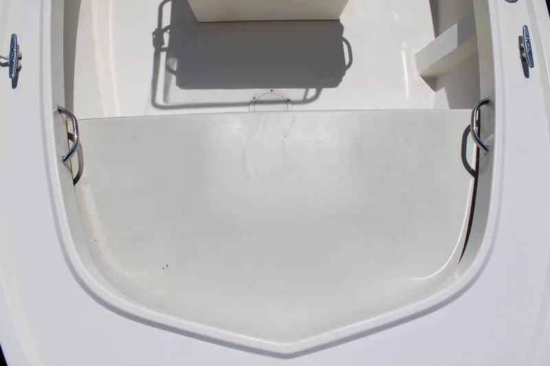 Slide: The Image of 2006 Parker 1801 Center Console boat interior, featuring a clean, white deck and seating area. - 18
