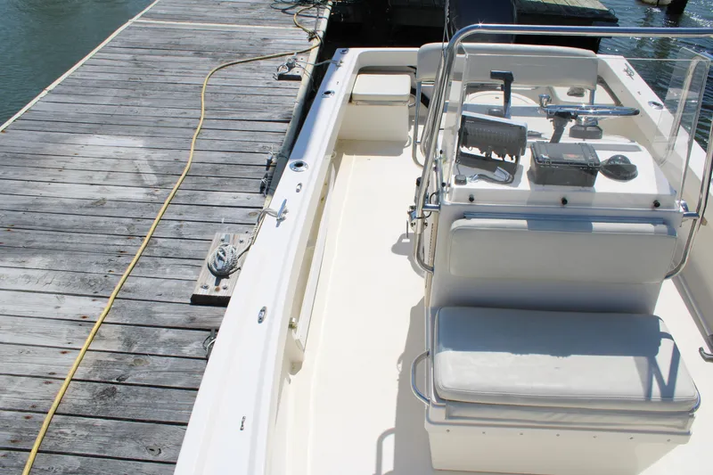 Slide: The Image of 2006 Parker 1801 Center Console boat docked at a wooden pier. - 21