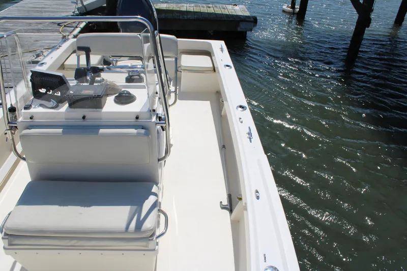 Slide: The Image of 2006 Parker 1801 Center Console boat docked by the water. - 22