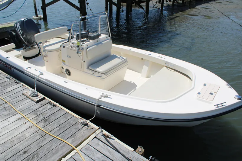 Slide: The Image of 2006 Parker 1801 Center Console boat docked by wooden pier. - 3
