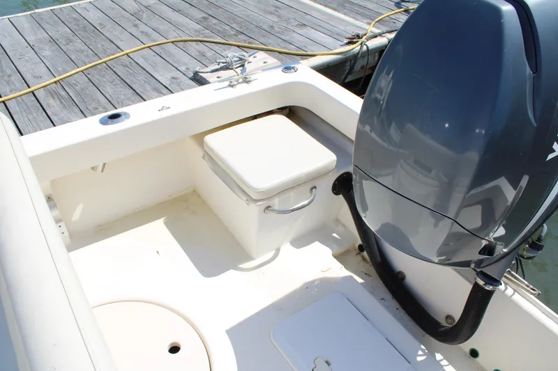 Slide: The Image of 2006 Parker 1801 Center Console boat interior with engine and seating. - 7