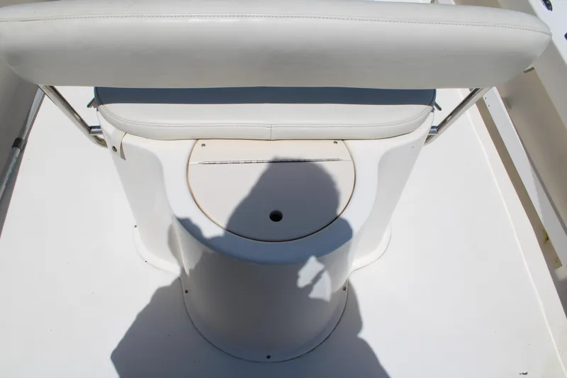 Slide: The Image of 2006 Parker 1801 Center Console boat seat with shadow on white deck. - 8