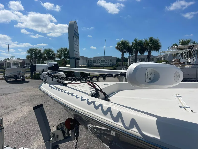 Slide: The Image of 2020 Bulls Bay 2400 boat on trailer under clear blue sky. - 12