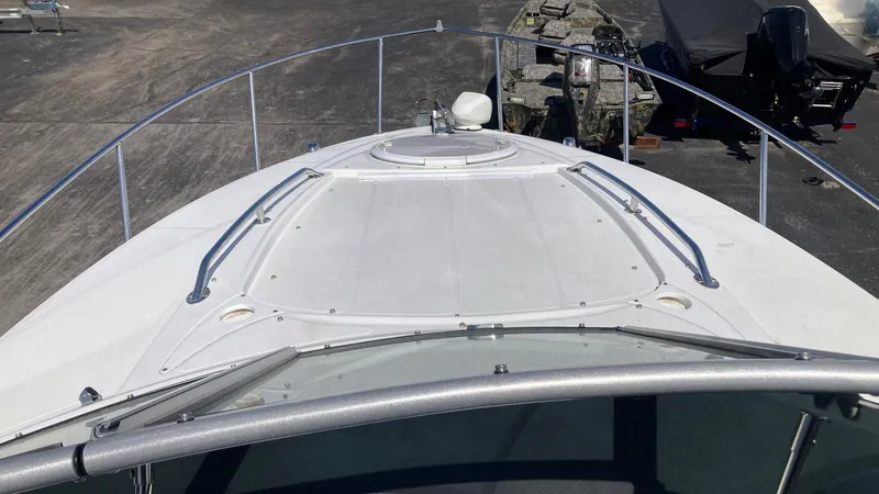 Slide: The Image of 2018 Monterey 275 Sport Yacht bow view with railings and deck details. - 10