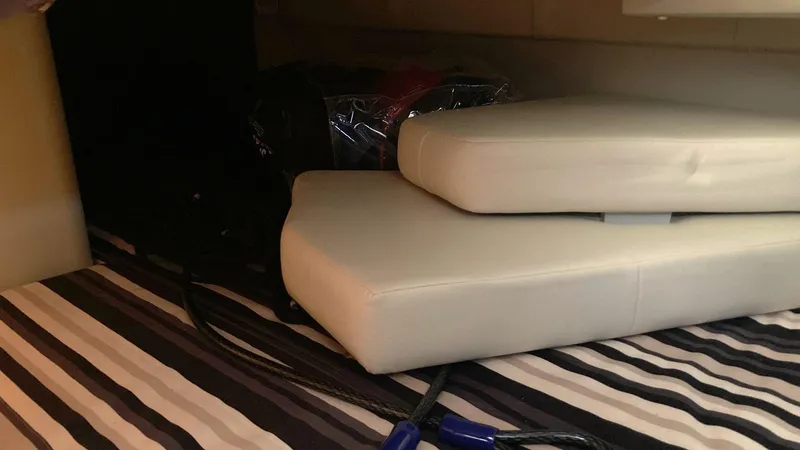 Slide: The Image of Interior cabin of 2018 Monterey 275 Sport Yacht with cushions and striped flooring. - 16