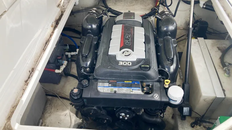Slide: The Image of Engine compartment of a 2018 Monterey 275 Sport Yacht, featuring a 300 horsepower engine. - 18