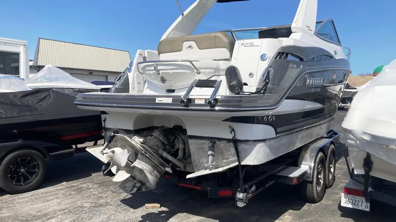 Slide: The Image of 2018 Monterey 275 Sport Yacht on trailer, rear view, in a marina setting. - 3