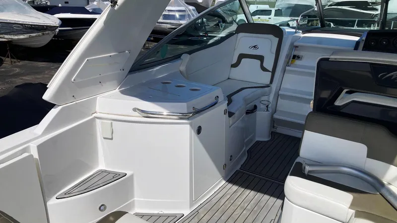 Slide: The Image of 2018 Monterey 275 Sport Yacht interior with sleek seating and modern design. - 6