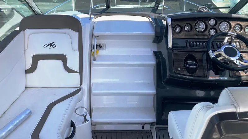 Slide: The Image of 2018 Monterey 275 Sport Yacht cockpit with modern dashboard and seating. - 9