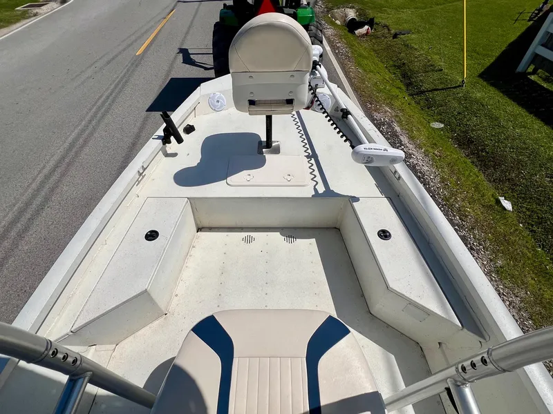 Slide: The Image of 2019 G3 Bay 20 DLX boat interior with seating and steering console. - 14