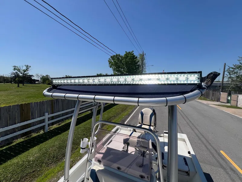 Slide: The Image of 2019 G3 Bay 20 DLX boat with LED light bar on a sunny road. - 20