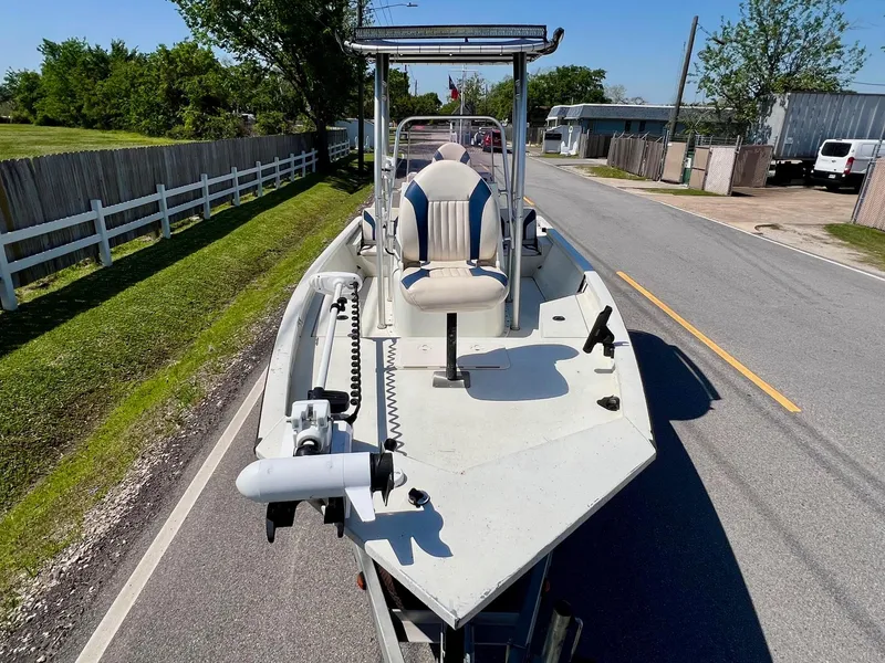 Slide: The Image of 2019 G3 Bay 20 DLX boat on trailer, parked on a suburban street. - 6