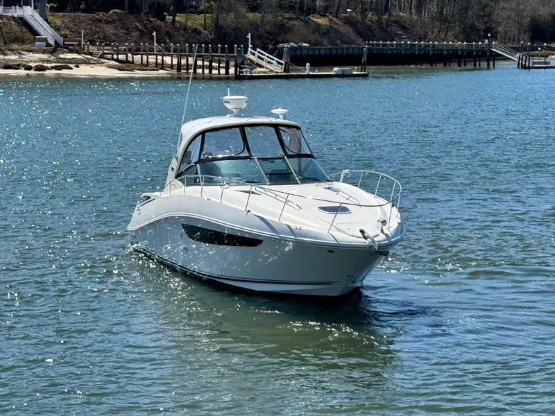 Slide: The Image of 2014 Sea Ray 370 Sundancer cruising on a sunny day in a serene waterway. - 3