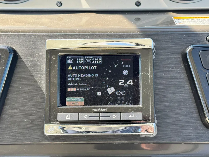 Slide: The Image of Autopilot display on 2014 Sea Ray 370 Sundancer, showing active auto heading. - 31