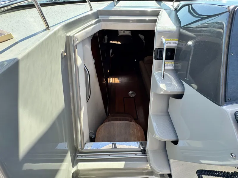 Slide: The Image of 2014 Sea Ray 370 Sundancer cabin entrance with steps and interior view. - 35