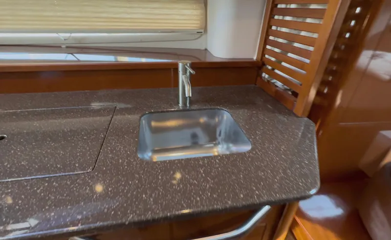 Slide: The Image of Luxurious kitchen sink area in 2014 Sea Ray 370 Sundancer yacht. - 44