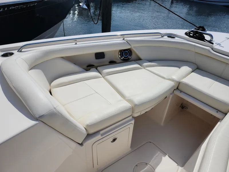 Slide: The Image of Luxurious seating on 2016 Grady-White Freedom 335 boat, featuring white cushioned upholstery. - 20